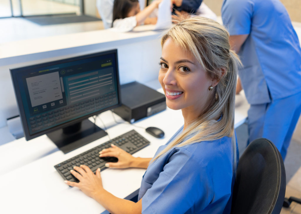 woman typing at computer