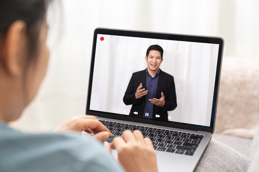 Woman watching presentation on a laptop