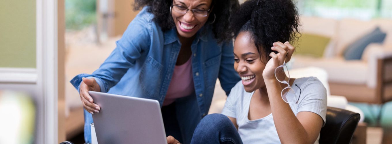 Two female students of different ages work together and support each other.