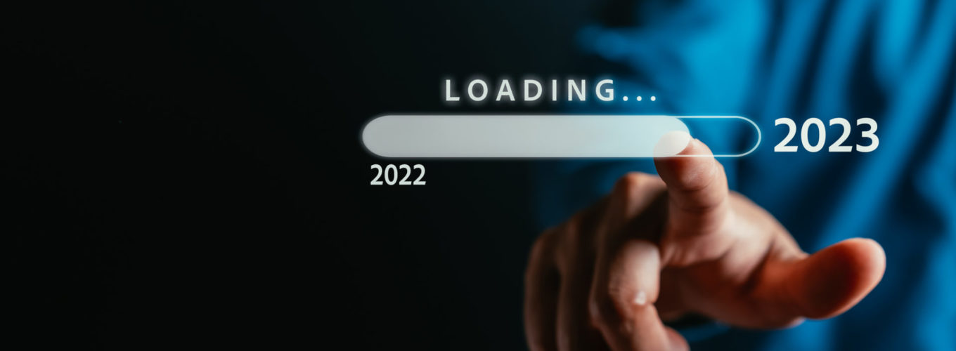 Businessman touching to virtual download bar and loading for New Year and changing year 2022 to 2023. start up planing business in next years concept.