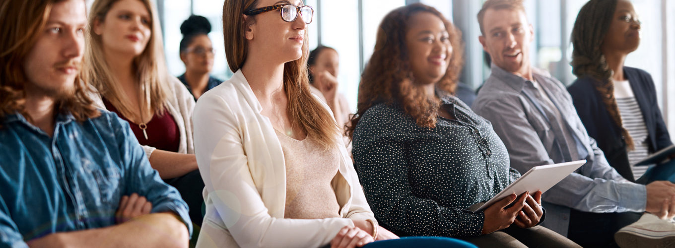 Shot of a group of businesspeople attending a conference